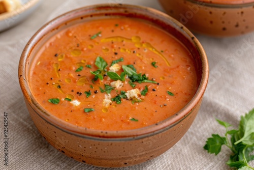 Fresh Tomato Basil Soup Served With Croutons and Cherry Tomatoes on a Linen T...