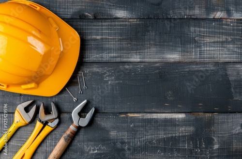 Construction Tools and Safety Helmets on Wooden Surface in a Workshop