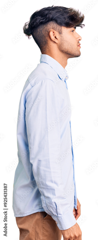 Young hispanic man wearing casual shirt looking to side, relax profile pose with natural face with confident smile. Young hispanic man wearing casual shirt looking to side, relax profile pose with natural face with confident smile.