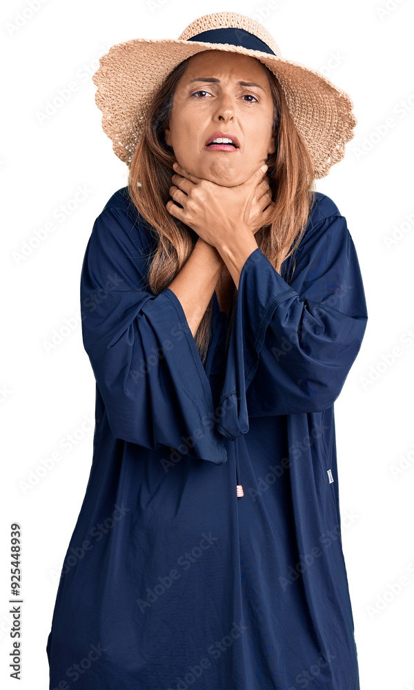 Fototapeta premium Middle age hispanic woman wearing summer hat shouting and suffocate because painful strangle. health problem. asphyxiate and suicide concept.