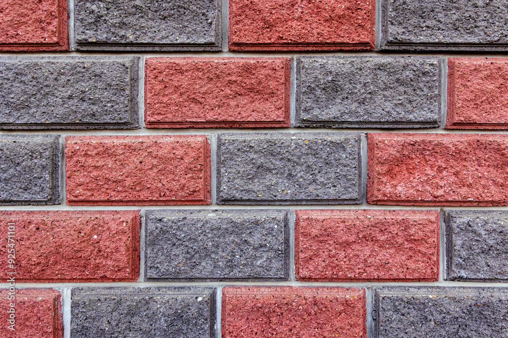 Close-up of a red and grey brick wall pattern. A detailed close-up image of a red and grey brick wall, showcasing the texture and pattern of the bricks. Close-up of a red and grey brick wall pattern. A detailed close-up image of a red and grey brick wall, showcasing the texture and pattern of the bricks.