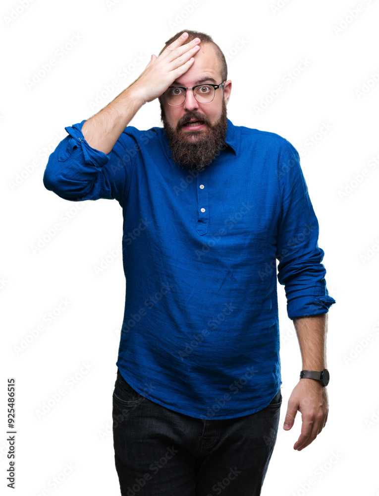 Young caucasian hipster man wearing glasses over isolated background surprised with hand on head for mistake, remember error. Forgot, bad memory concept. Young caucasian hipster man wearing glasses over isolated background surprised with hand on head for mistake, remember error. Forgot, bad memory concept.