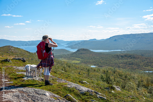 Woman hiking in Lapland Finland with dogs