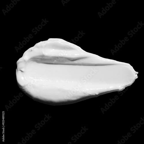 White cosmetic cream texture, skincare lotion swatch on black background. Face creme, body moisturiser, hair conditioner smear smudge stroke. Creamy beauty product closeup