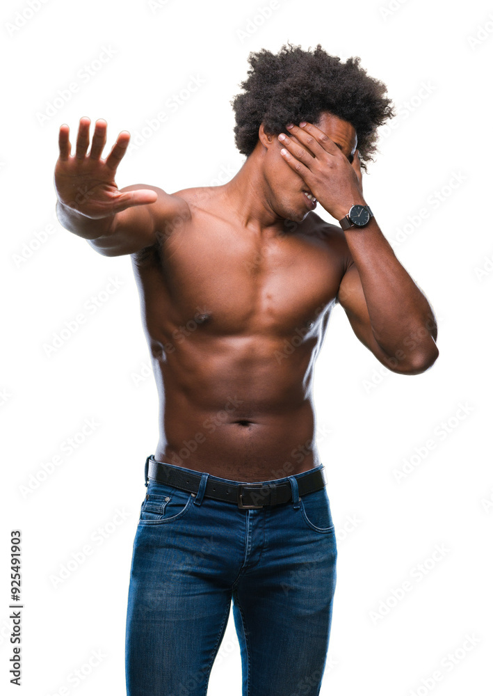Afro american shirtless man showing nude body over isolated background covering eyes with hands and doing stop gesture with sad and fear expression. Embarrassed and negative concept. Afro american shirtless man showing nude body over isolated background covering eyes with hands and doing stop gesture with sad and fear expression. Embarrassed and negative concept.