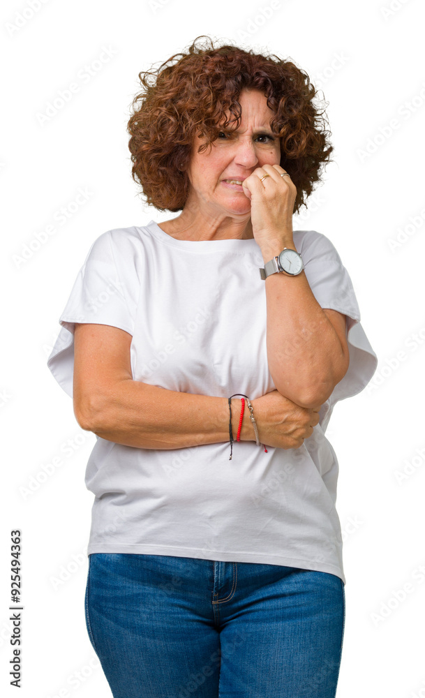 Beautiful middle ager senior woman wearing white t-shirt over isolated background looking stressed and nervous with hands on mouth biting nails. Anxiety problem. Beautiful middle ager senior woman wearing white t-shirt over isolated background looking stressed and nervous with hands on mouth biting nails. Anxiety problem.