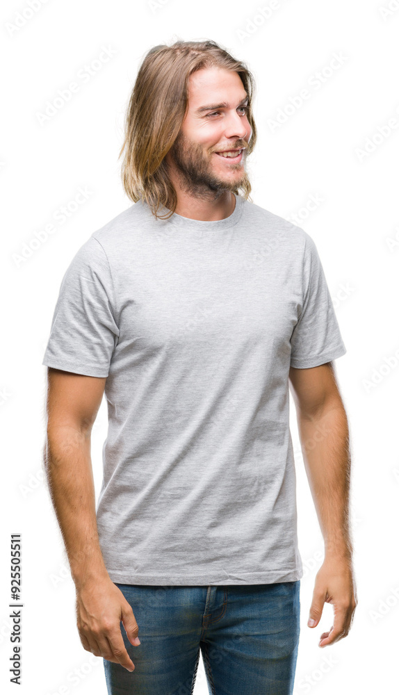 Young handsome man with long hair over isolated background looking away to side with smile on face, natural expression. Laughing confident. Young handsome man with long hair over isolated background looking away to side with smile on face, natural expression. Laughing confident.