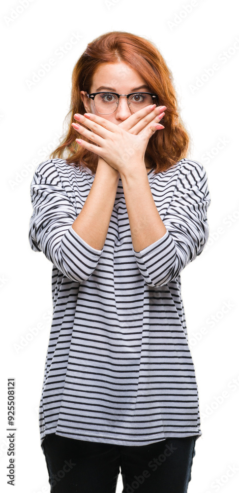 Young beautiful woman over isolated background wearing glasses shocked covering mouth with hands for mistake. Secret concept. Young beautiful woman over isolated background wearing glasses shocked covering mouth with hands for mistake. Secret concept.