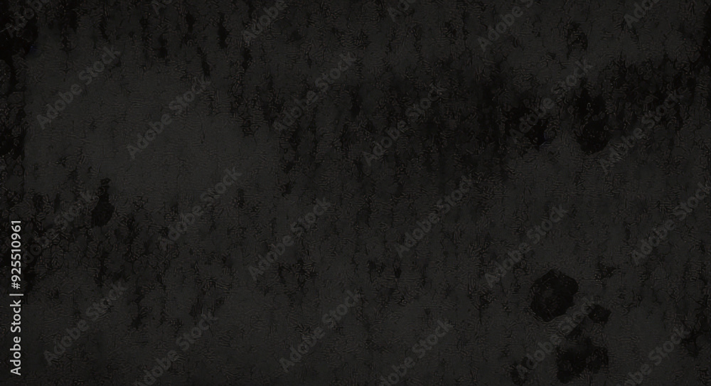Black background made of real, shiny black paper covered with foil, illuminated by a soft light from above. Black background made of real, shiny black paper covered with foil, illuminated by a soft light from above.