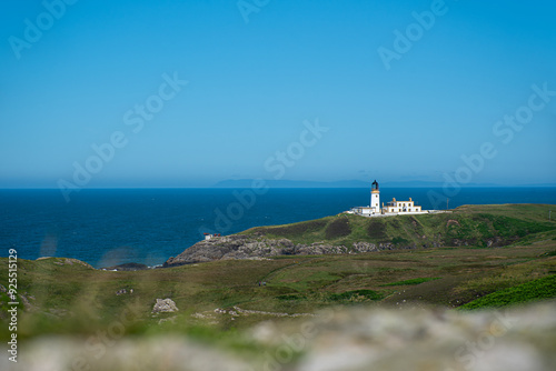 Landscape photography of lighthouse and blue sky; wave; viewpoint; scenic; rocky coast; seascape; sunny; rock; stone; travel; Scotland; UK; Portpatrick