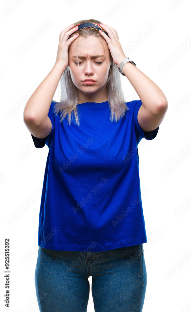 Young blonde woman over isolated background suffering from headache desperate and stressed because pain and migraine. Hands on head. Young blonde woman over isolated background suffering from headache desperate and stressed because pain and migraine. Hands on head.