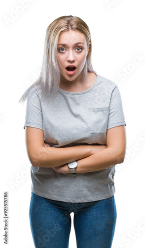 Young blonde woman over isolated background afraid and shocked with surprise expression, fear and excited face.