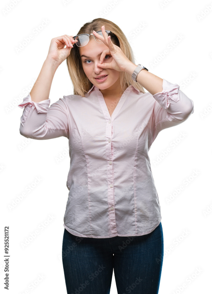Young caucasian business woman wearing glasses over isolated background doing ok gesture with hand smiling, eye looking through fingers with happy face. Young caucasian business woman wearing glasses over isolated background doing ok gesture with hand smiling, eye looking through fingers with happy face.