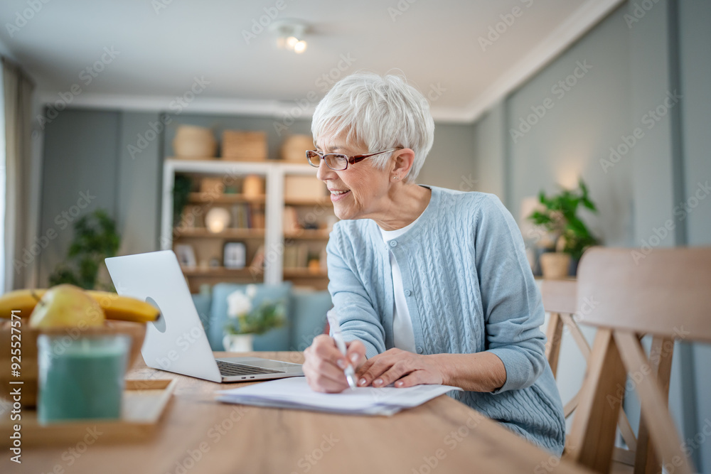 Senior caucasian woman use laptop computer at home for work Senior caucasian woman use laptop computer at home for work