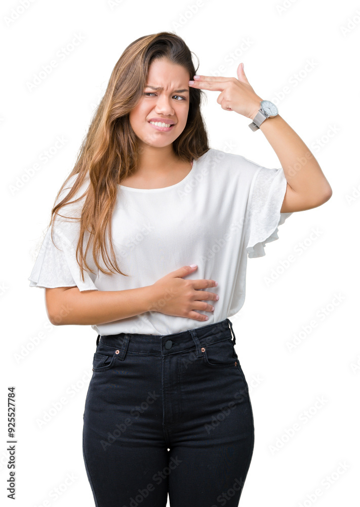 Obraz premium Young beautiful brunette business woman over isolated background Shooting and killing oneself pointing hand and fingers to head, suicide gesture.