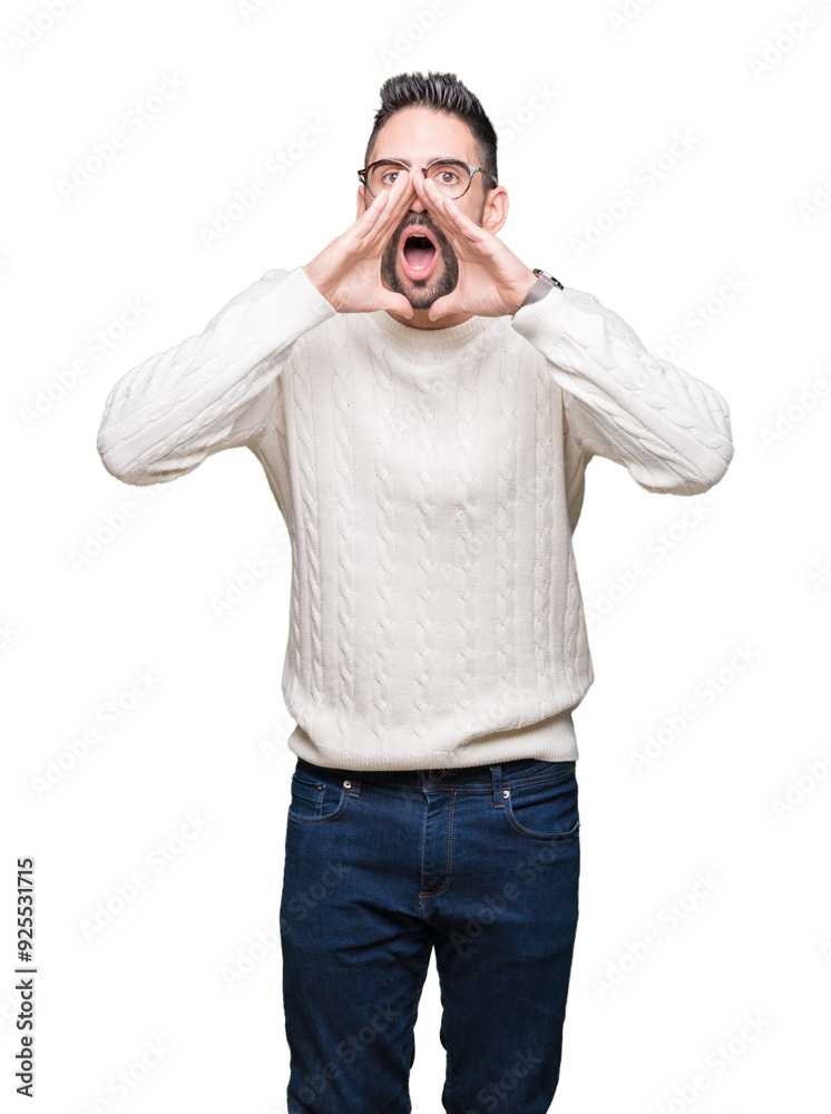 Fototapeta premium Young handsome man wearing glasses over isolated background Shouting angry out loud with hands over mouth