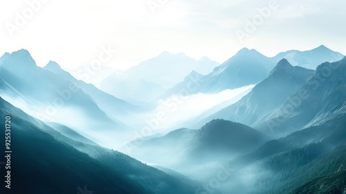 Majestic mountains emerge from the mist, bathed in soft morning light, creating a tranquil and ethereal landscape that inspires calmness and reflection