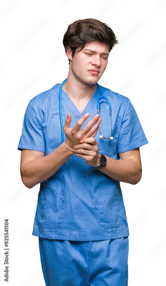 Young doctor wearing medical uniform over isolated background Suffering pain on hands and fingers, arthritis inflammation Young doctor wearing medical uniform over isolated background Suffering pain on hands and fingers, arthritis inflammation
