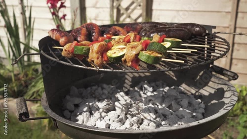 cooking on the barbecue in the garden during summer bbq