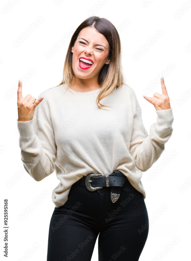 Young beautiful woman casual white sweater over isolated background shouting with crazy expression doing rock symbol with hands up. Music star. Heavy concept. Young beautiful woman casual white sweater over isolated background shouting with crazy expression doing rock symbol with hands up. Music star. Heavy concept.