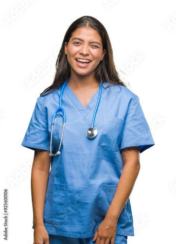 Young arab doctor surgeon woman over isolated background winking looking at the camera with sexy expression, cheerful and happy face.