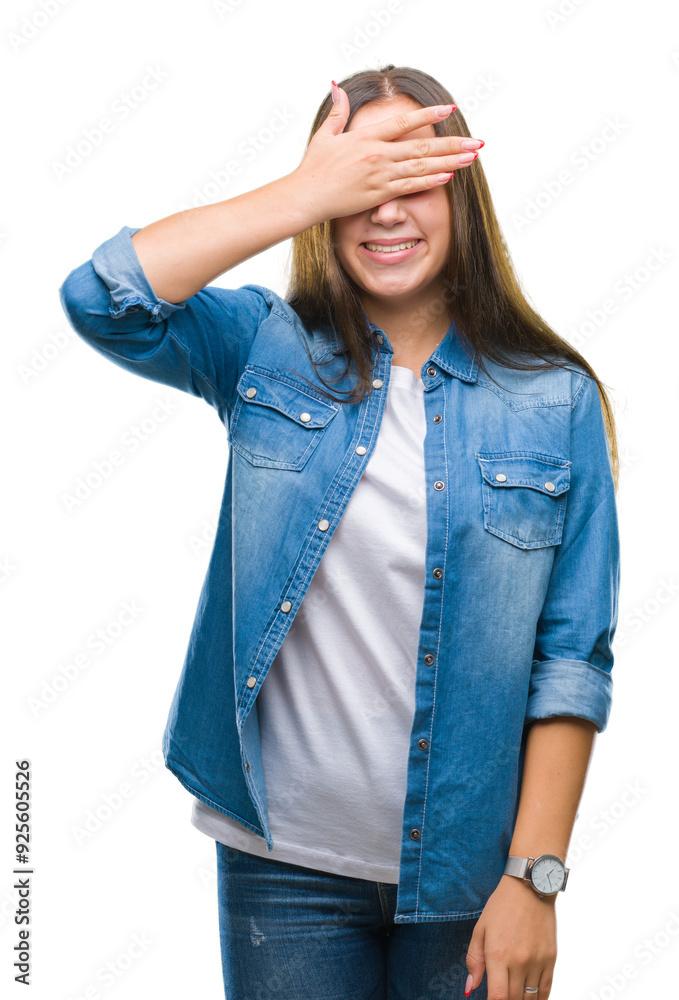 Young caucasian beautiful woman over isolated background smiling and laughing with hand on face covering eyes for surprise. Blind concept. Young caucasian beautiful woman over isolated background smiling and laughing with hand on face covering eyes for surprise. Blind concept.