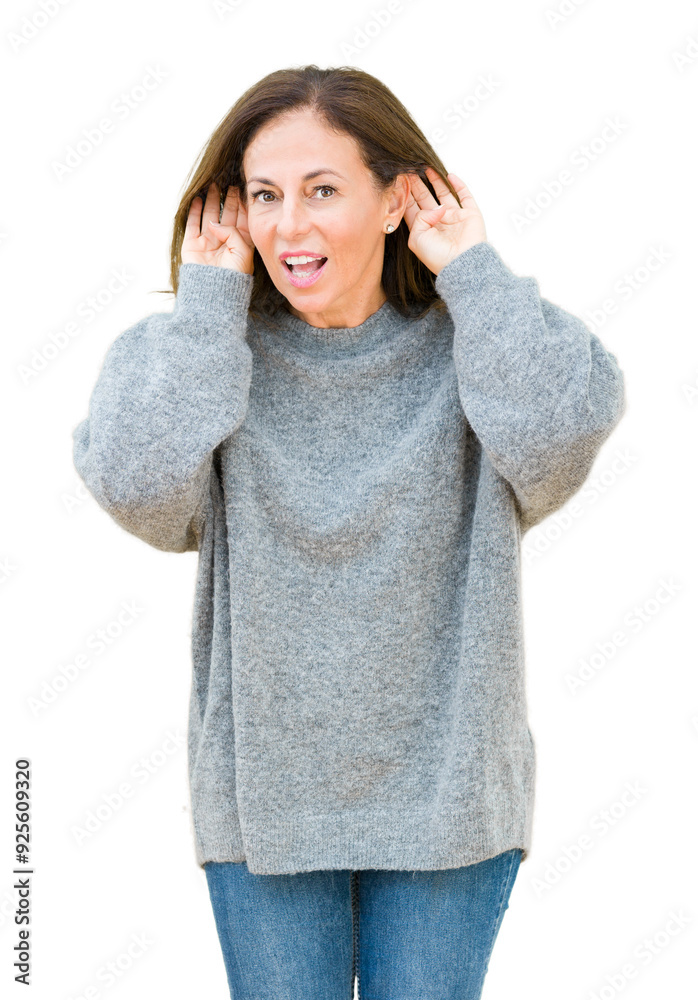 Beautiful middle age woman wearing winter sweater over isolated background Trying to hear both hands on ear gesture, curious for gossip. Hearing problem, deaf Beautiful middle age woman wearing winter sweater over isolated background Trying to hear both hands on ear gesture, curious for gossip. Hearing problem, deaf
