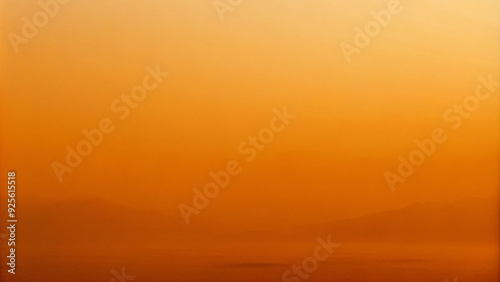 Misty in warm sunrise light, nature's canvas painted with soft orange hues