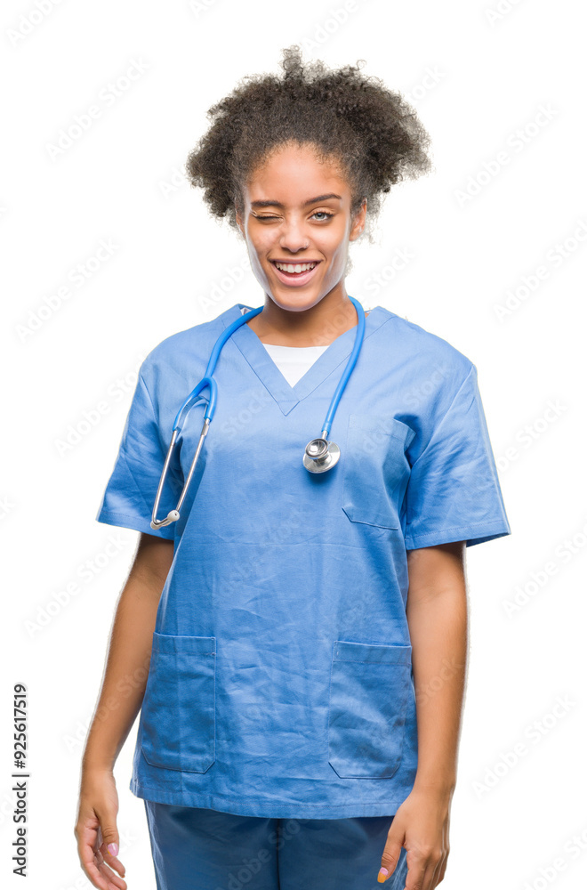 Young afro american doctor woman over isolated background winking looking at the camera with sexy expression, cheerful and happy face. Young afro american doctor woman over isolated background winking looking at the camera with sexy expression, cheerful and happy face.
