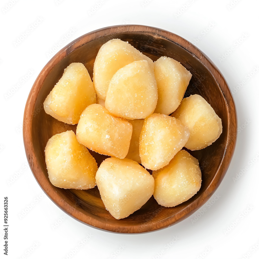 a bowl of cut up potatoes on a white surface a bowl of cut up potatoes on a white surface