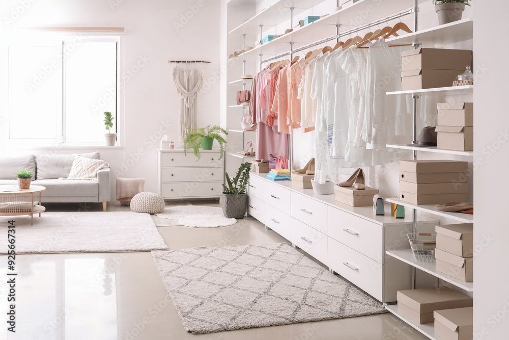 Big wardrobe with stylish clothes and accessories
