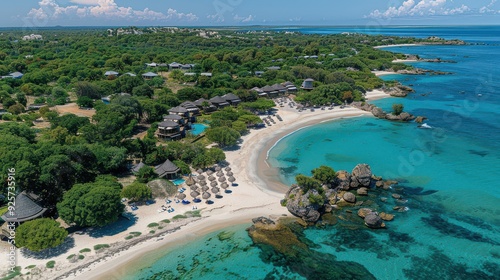 Aerial View of Scenic Beach Resort with Clear Turquoise Waters, White Sandy Beaches, and Lush Green Surroundings on a Sunny Day