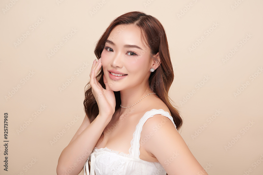 Beautiful young asian woman with clean fresh skin on beige background, Face care, Facial treatment, Cosmetology, beauty and spa, Asian women portrait. Beautiful young asian woman with clean fresh skin on beige background, Face care, Facial treatment, Cosmetology, beauty and spa, Asian women portrait.
