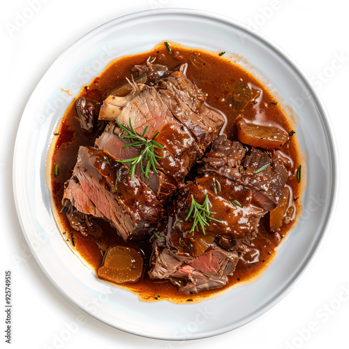 a plate of beef and potatoes with gravy