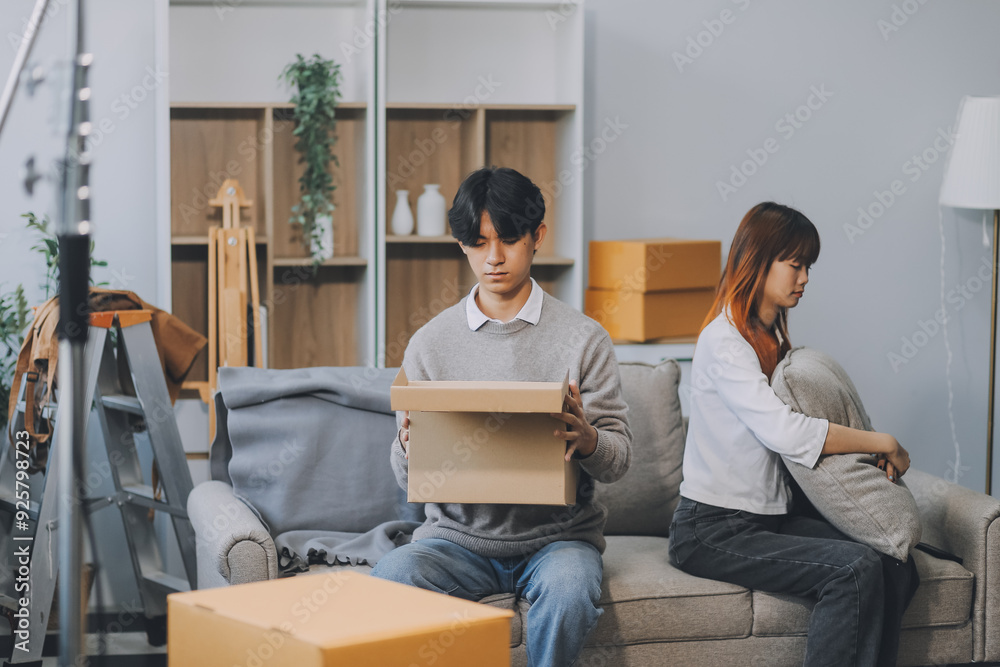 Offended couple ignoring each other after quarrel indoors, selective focus. Relationship problems Offended couple ignoring each other after quarrel indoors, selective focus. Relationship problems