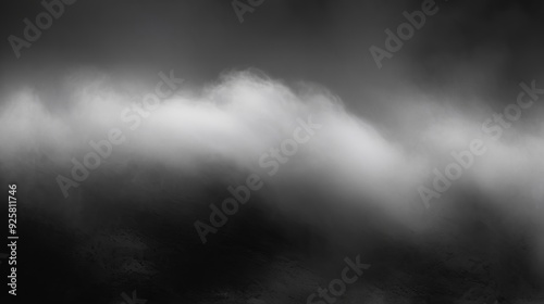 Dark black noise texture with soft, blurry white patches creating a misty, ethereal look. Made with generative AI technology