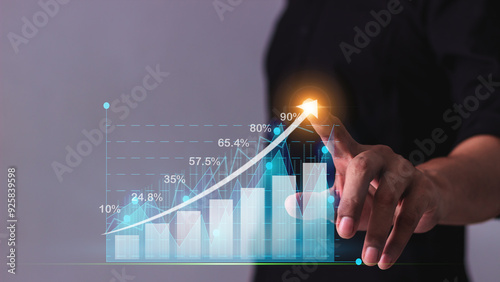 Hand young business man touch Value of money and investment for success and wealth analysis with rising graph financial