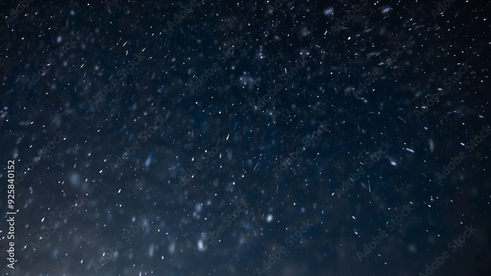 Obraz premium Snow is falling on blue night background from the starry sky on New Year's Eve
