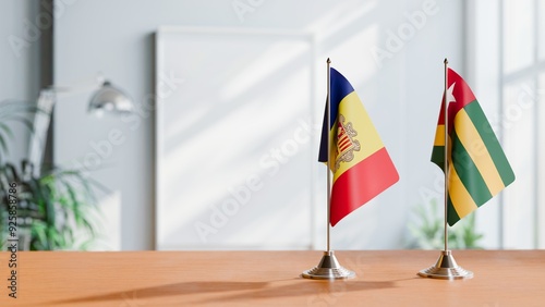 FLAGS OF ANDORRA AND TOGO  ON TABLE photo