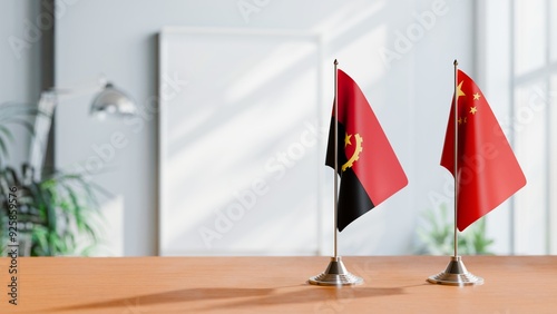 FLAGS OF ANGOLA AND CHINA  ON TABLE photo