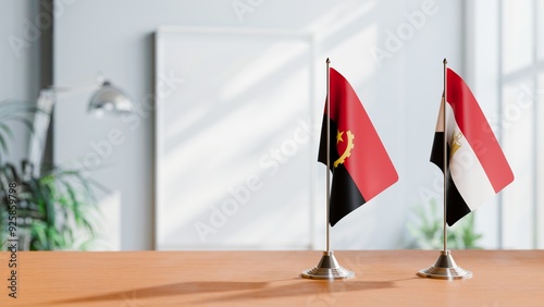 FLAGS OF ANGOLA AND EGYPT  ON TABLE photo