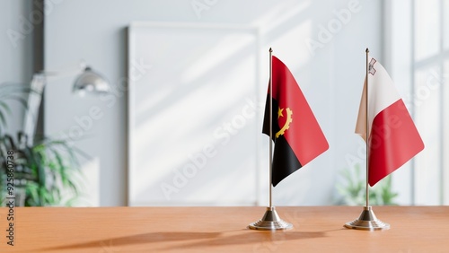 FLAGS OF ANGOLA AND MAROCCO  ON TABLE photo