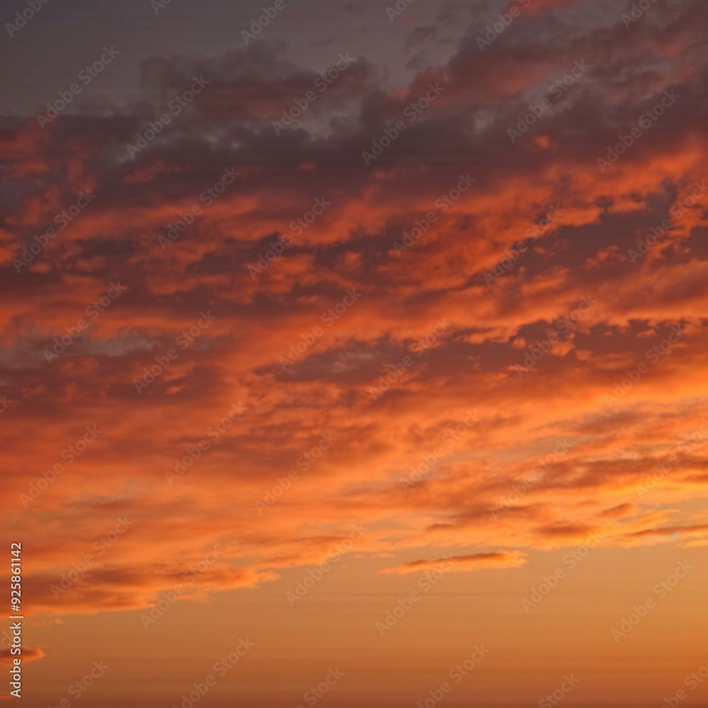 Stunning Sunset Sky with Vibrant Orange and Purple Clouds at Dusk Stunning Sunset Sky with Vibrant Orange and Purple Clouds at Dusk