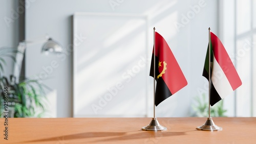 FLAGS OF ANGOLA AND SUDAN  ON TABLE photo