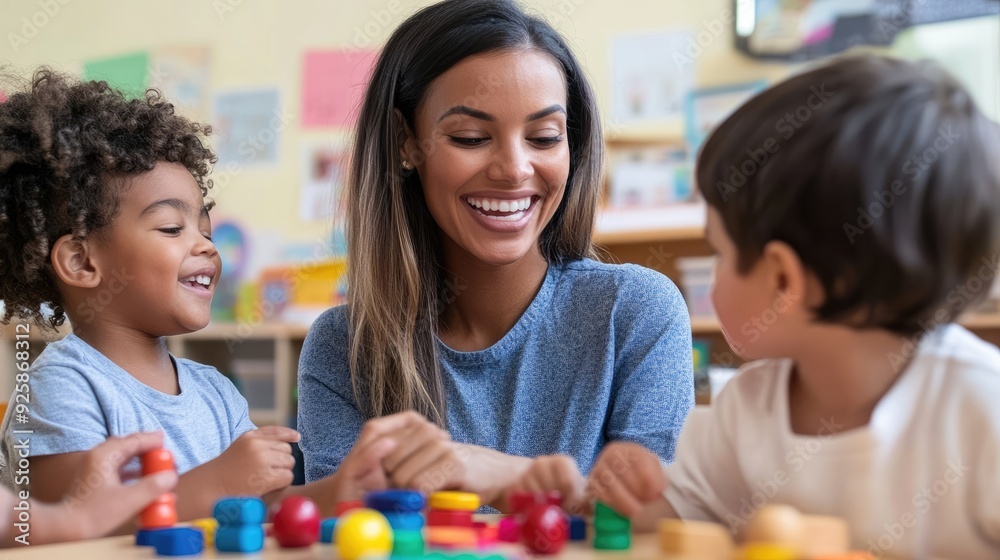 Teacher and children playing with building blocks in kindergarten Teacher and children playing with building blocks in kindergarten