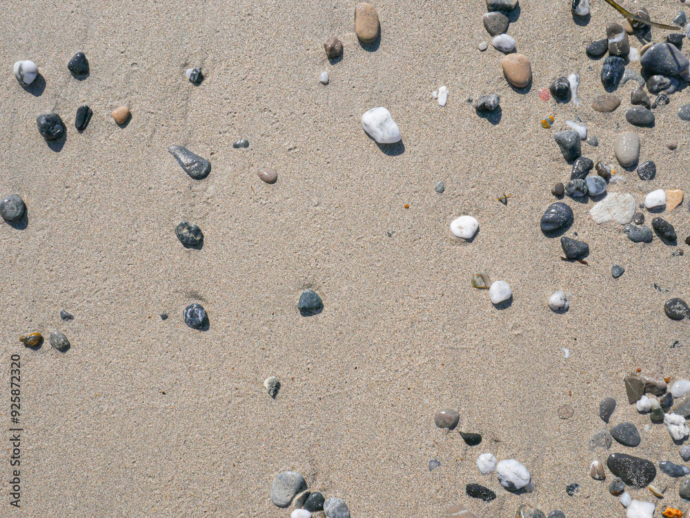 Background of colorful pebbles on the sand beach Background of colorful pebbles on the sand beach