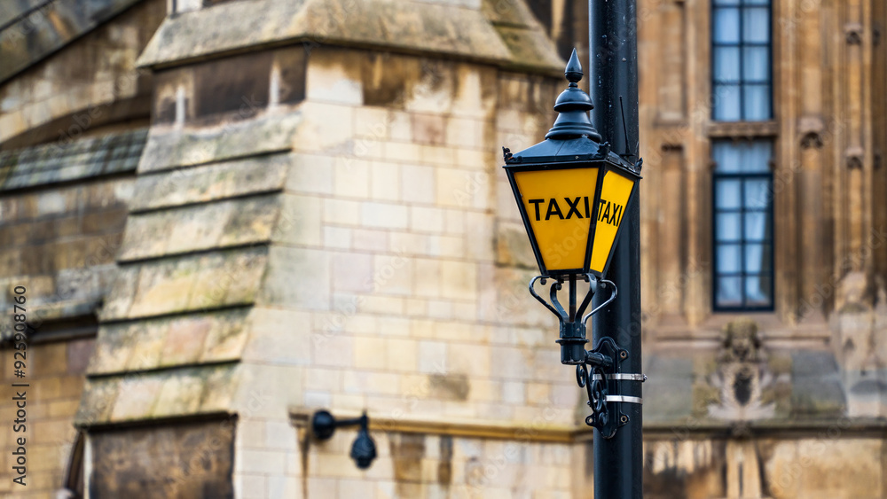 Classic Yellow Taxi Lantern Outside the Historic Houses of Parliament in London Classic Yellow Taxi Lantern Outside the Historic Houses of Parliament in London