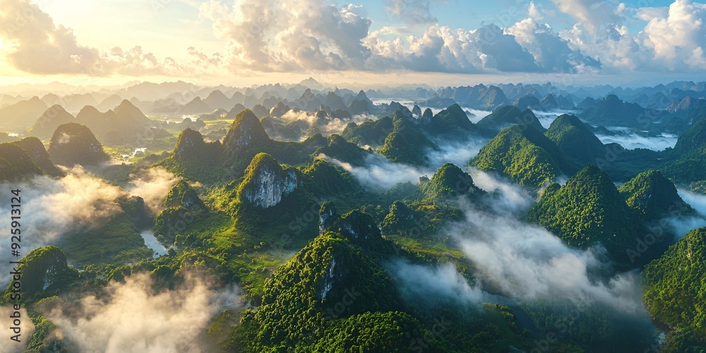 Bird's-eye perspective of limestone peaks beneath a stunning sky of clouds. Bird's-eye perspective of limestone peaks beneath a stunning sky of clouds.