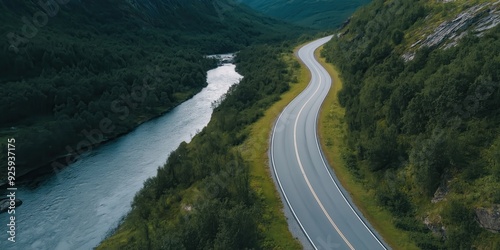 A road winding through a hilly Swiss landscape. With Copy Space.