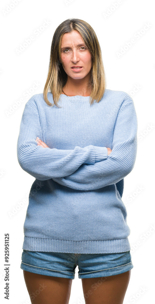 Young beautiful woman wearing winter sweater over isolated background skeptic and nervous, disapproving expression on face with crossed arms. Negative person. Young beautiful woman wearing winter sweater over isolated background skeptic and nervous, disapproving expression on face with crossed arms. Negative person.